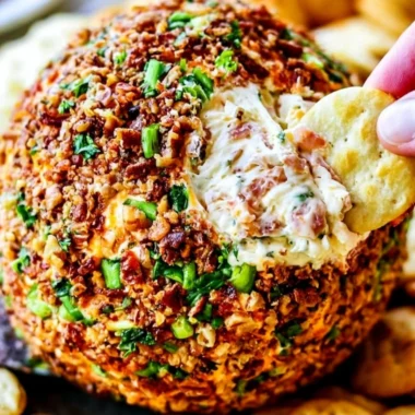Delicious Bacon Ranch Cheese Ball served on a platter with crackers