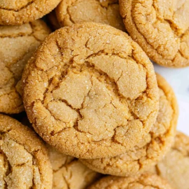 Freshly baked chewy brown sugar cookies on a cooling rack.