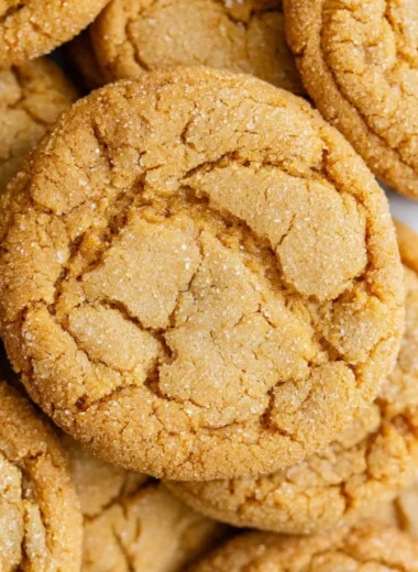 Freshly baked chewy brown sugar cookies on a cooling rack.