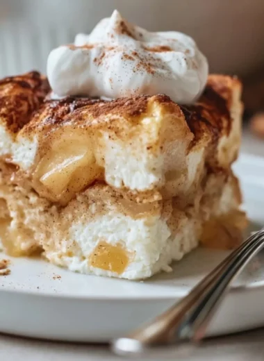 Baked apple and cinnamon dish with cottage cheese in a cozy setting