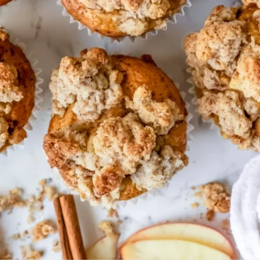 Cozy apple crumble muffins topped with a crunchy crumble crust