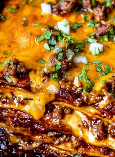 Delicious beef enchilada casserole topped with melted cheese