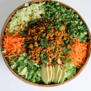 Cozy egg roll salad in a bowl with fresh ingredients and colorful toppings