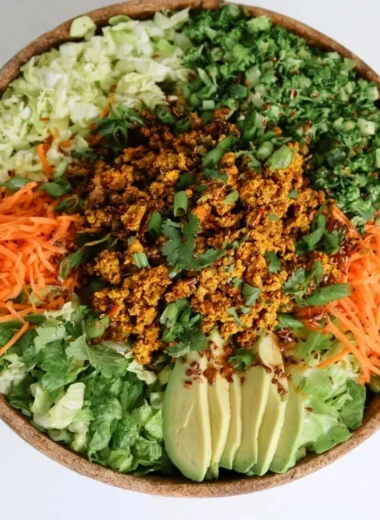 Cozy egg roll salad in a bowl with fresh ingredients and colorful toppings