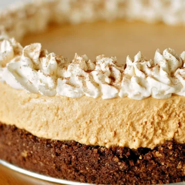 Cozy no-bake pumpkin silk pie with creamy filling and graham cracker crust