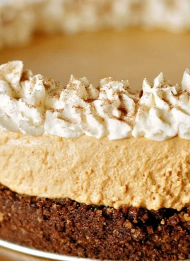 Cozy no-bake pumpkin silk pie with creamy filling and graham cracker crust