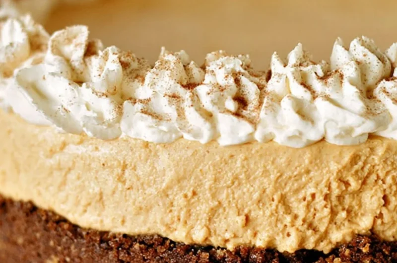 Cozy no-bake pumpkin silk pie with creamy filling and graham cracker crust