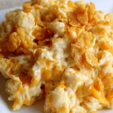 Baked creamy funeral potatoes dish in a casserole dish