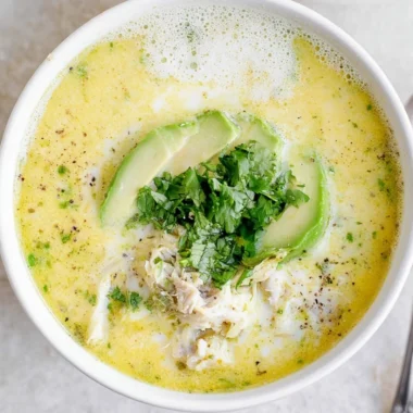 Delicious creamy white chicken chili served in a bowl with toppings.