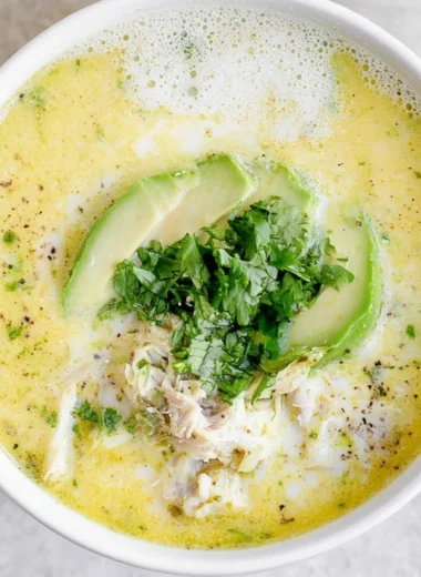 Delicious creamy white chicken chili served in a bowl with toppings.