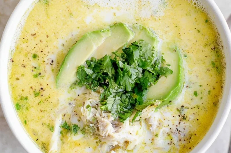 Delicious creamy white chicken chili served in a bowl with toppings.