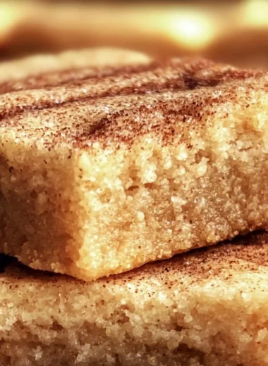 Delicious, chewy snickerdoodle cookie bars topped with cinnamon sugar