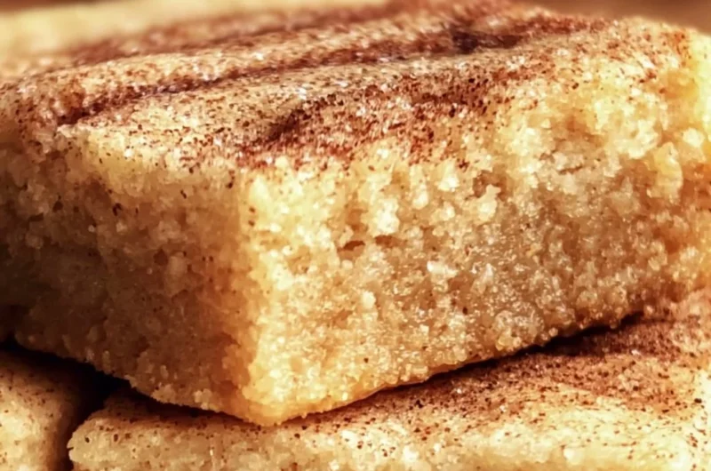 Delicious, chewy snickerdoodle cookie bars topped with cinnamon sugar