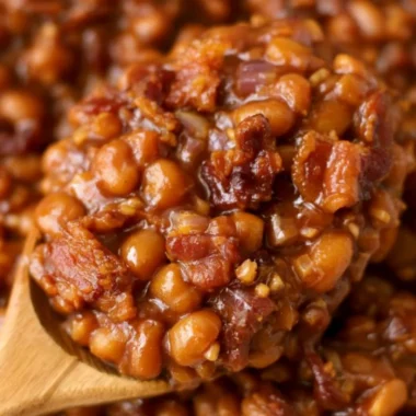 A delicious dish of easy ultimate baked beans garnished with herbs