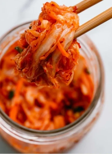 Bowl of homemade kimchi with vibrant vegetables and spices