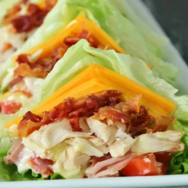 Keto and low carb chicken club sandwich with fresh ingredients and toppings