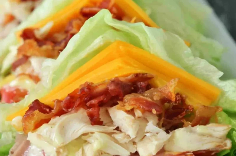 Keto and low carb chicken club sandwich with fresh ingredients and toppings