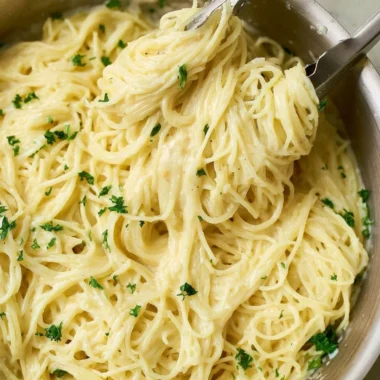 One Pot Garlic Parmesan Pasta with herbs and cheese served in a bowl