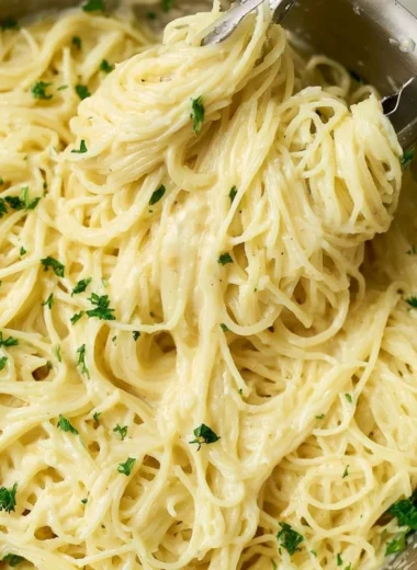 One Pot Garlic Parmesan Pasta with herbs and cheese served in a bowl