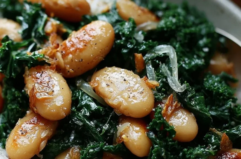 A serving of pan-fried beans with kale garnished with herbs