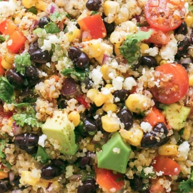 Colorful quinoa black bean salad with fresh vegetables and herbs