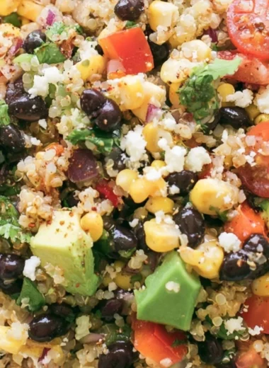 Colorful quinoa black bean salad with fresh vegetables and herbs