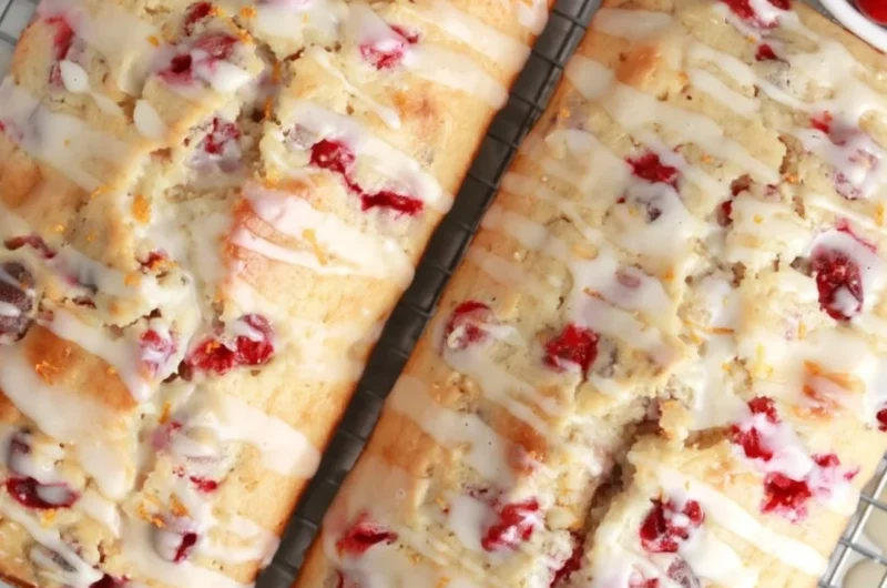 Freshly baked cranberry orange bread with cranberries and orange zest