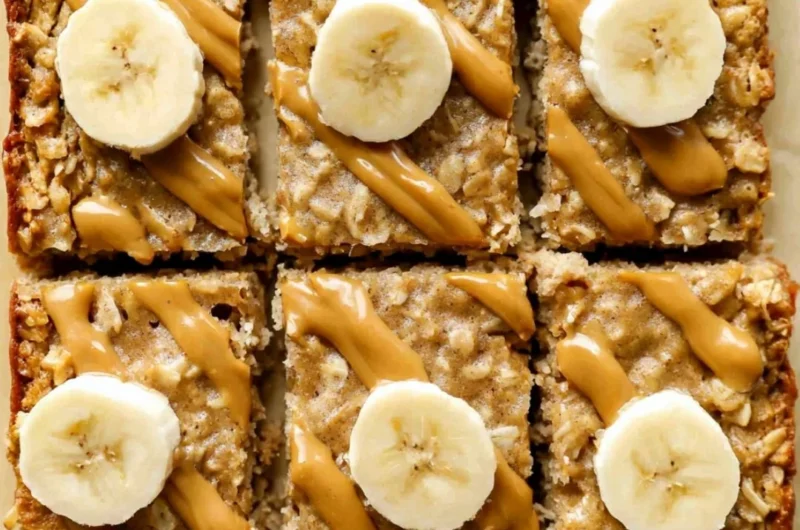 Delicious easy peanut butter baked oatmeal in a bowl, topped with banana slices.
