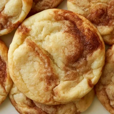 Delicious soft and chewy cinnamon roll cookies on a plate ready to enjoy.