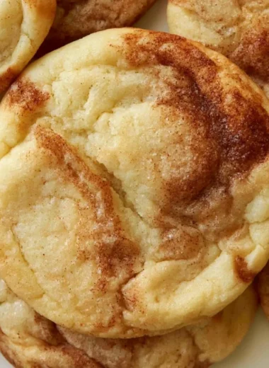 Delicious soft and chewy cinnamon roll cookies on a plate ready to enjoy.